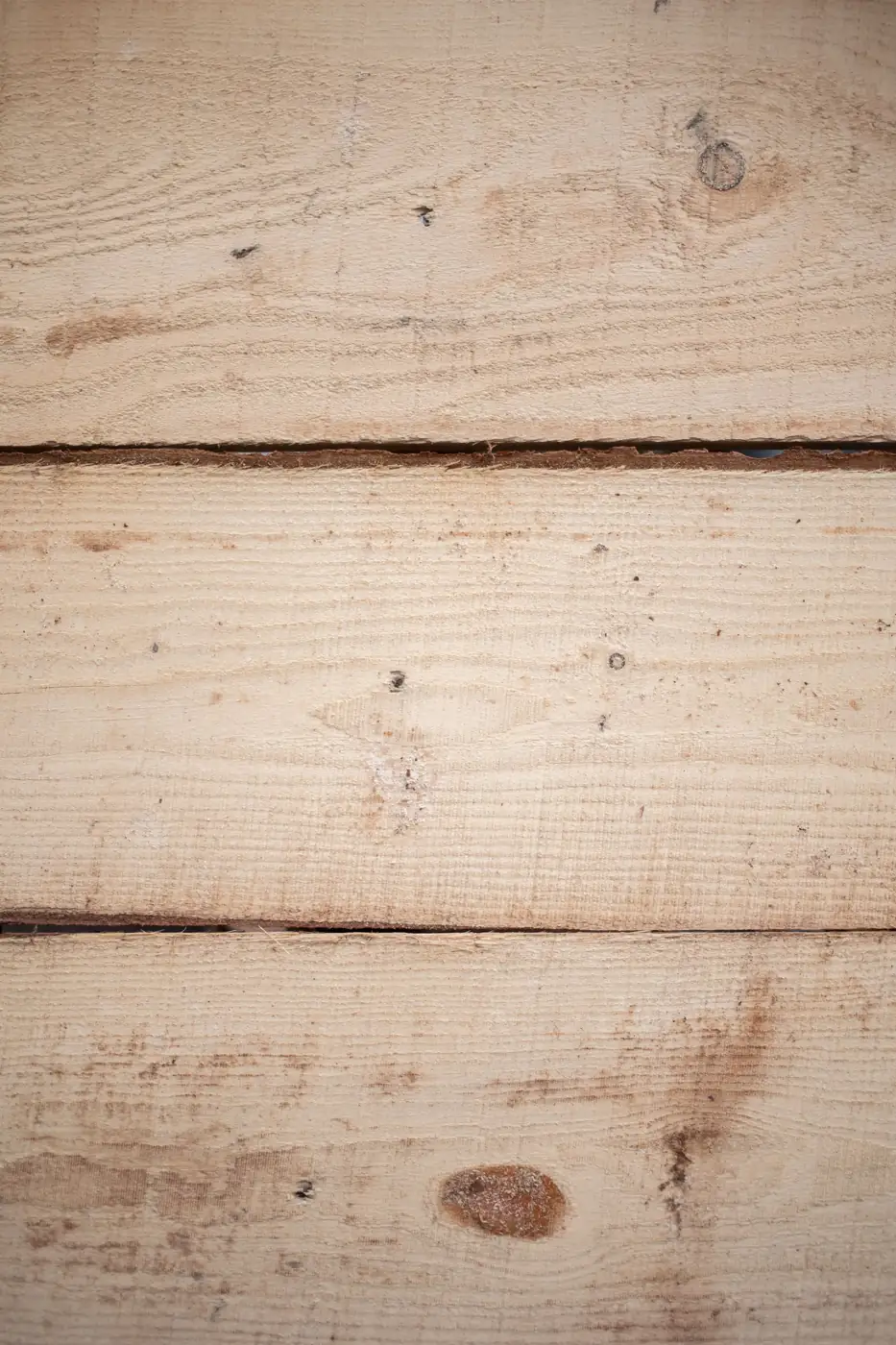 Light unfinished timber planks with natural knots
