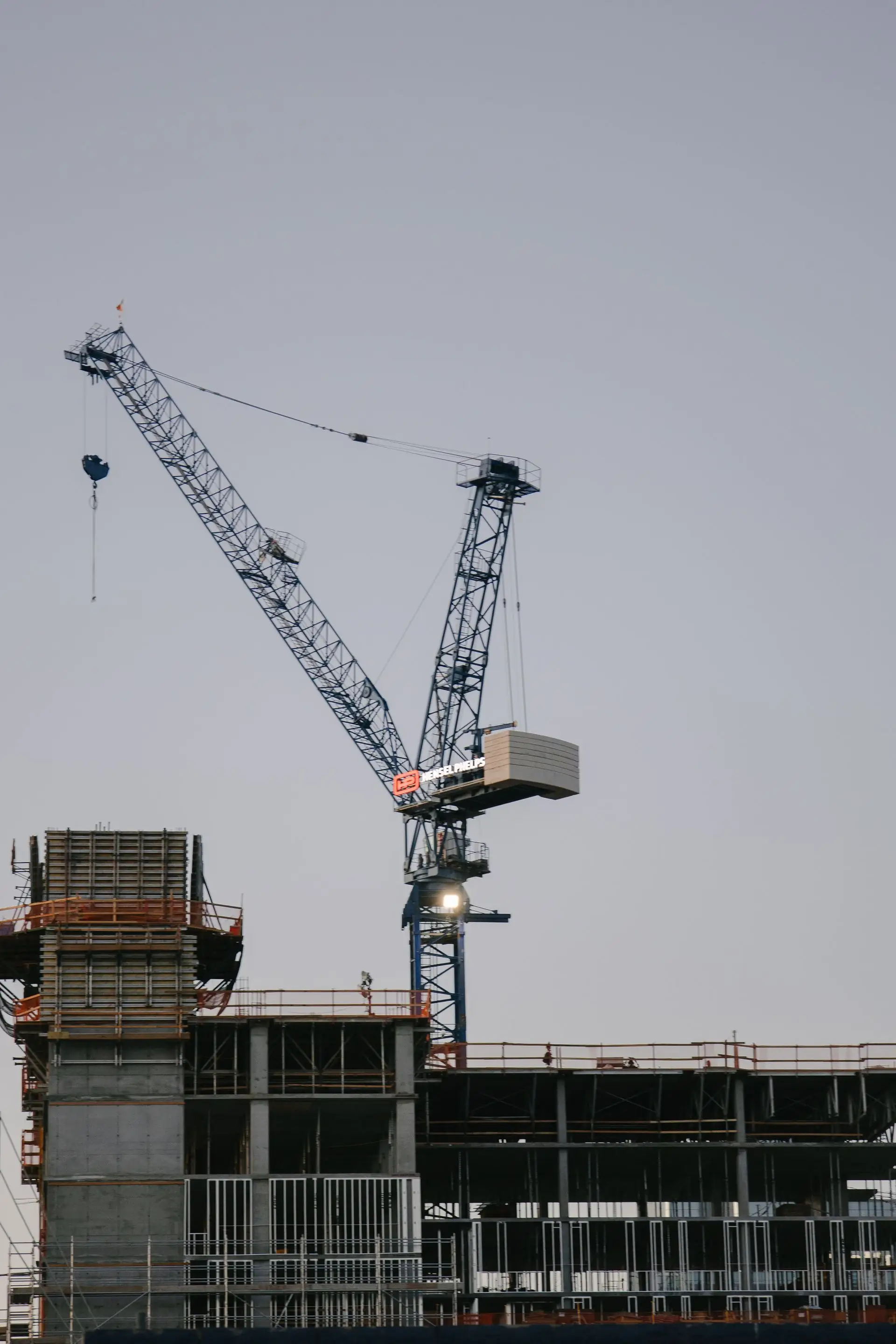 Building under construction with crane