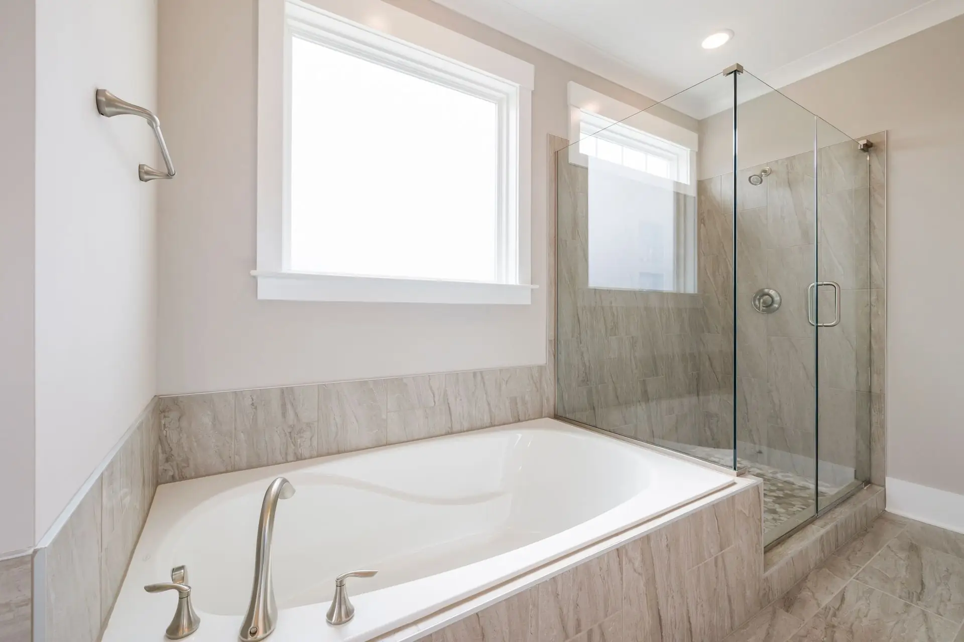 Bathroom with marble accents and glass shower