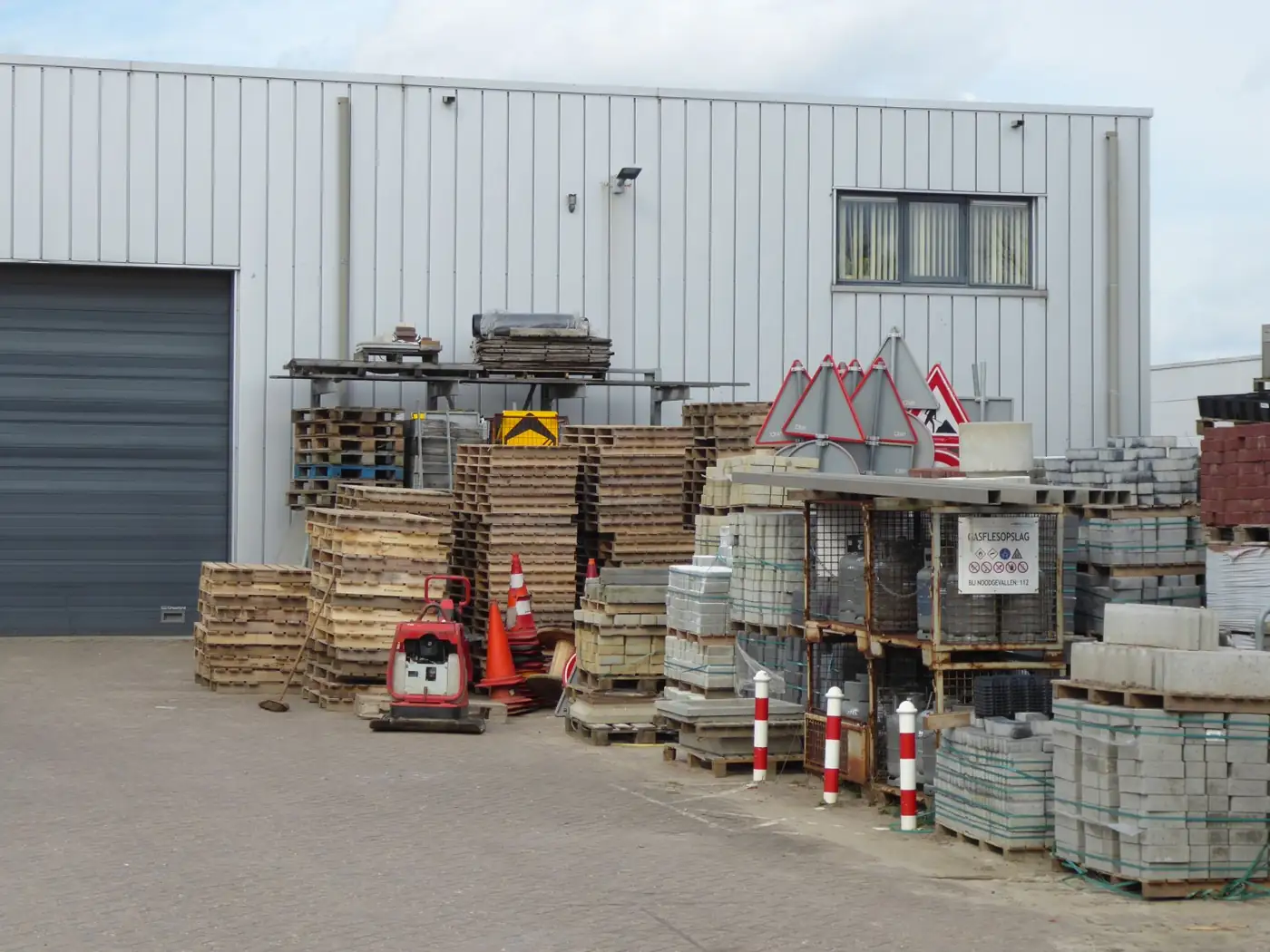 Outdoor materials yard with pallets and paving stock